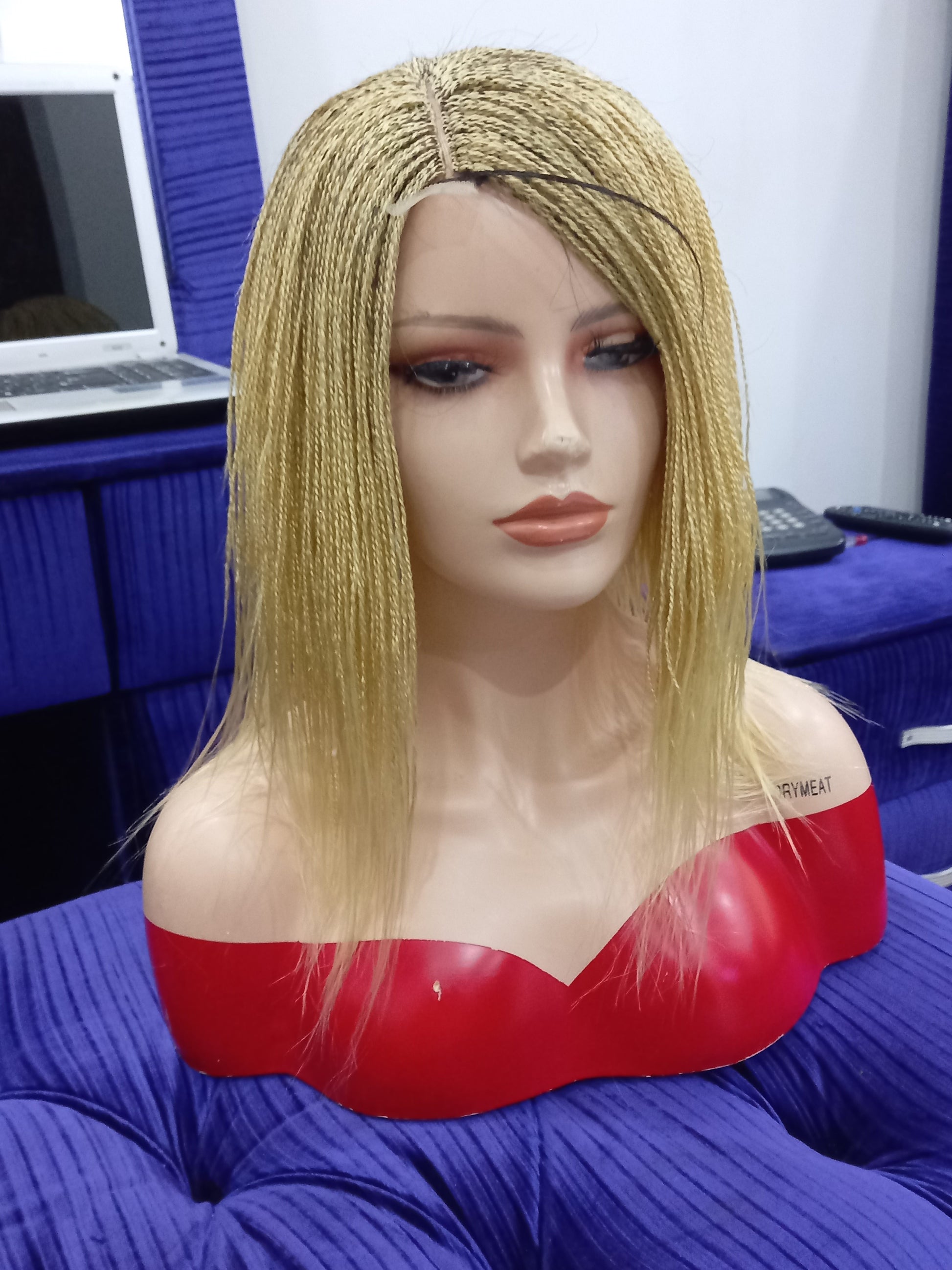 This beautiful blonde micro twist wig is a must-have for every woman. Available in different colors with free shipping on our website - BRAIDED WIG BOSS