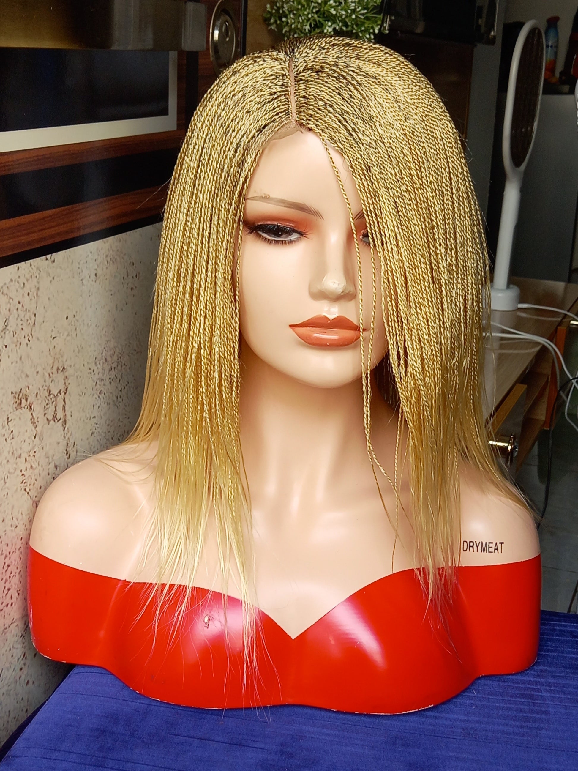 This beautiful blonde micro twist wig is a must-have for every woman. Available in different colors with free shipping on our website - BRAIDED WIG BOSS