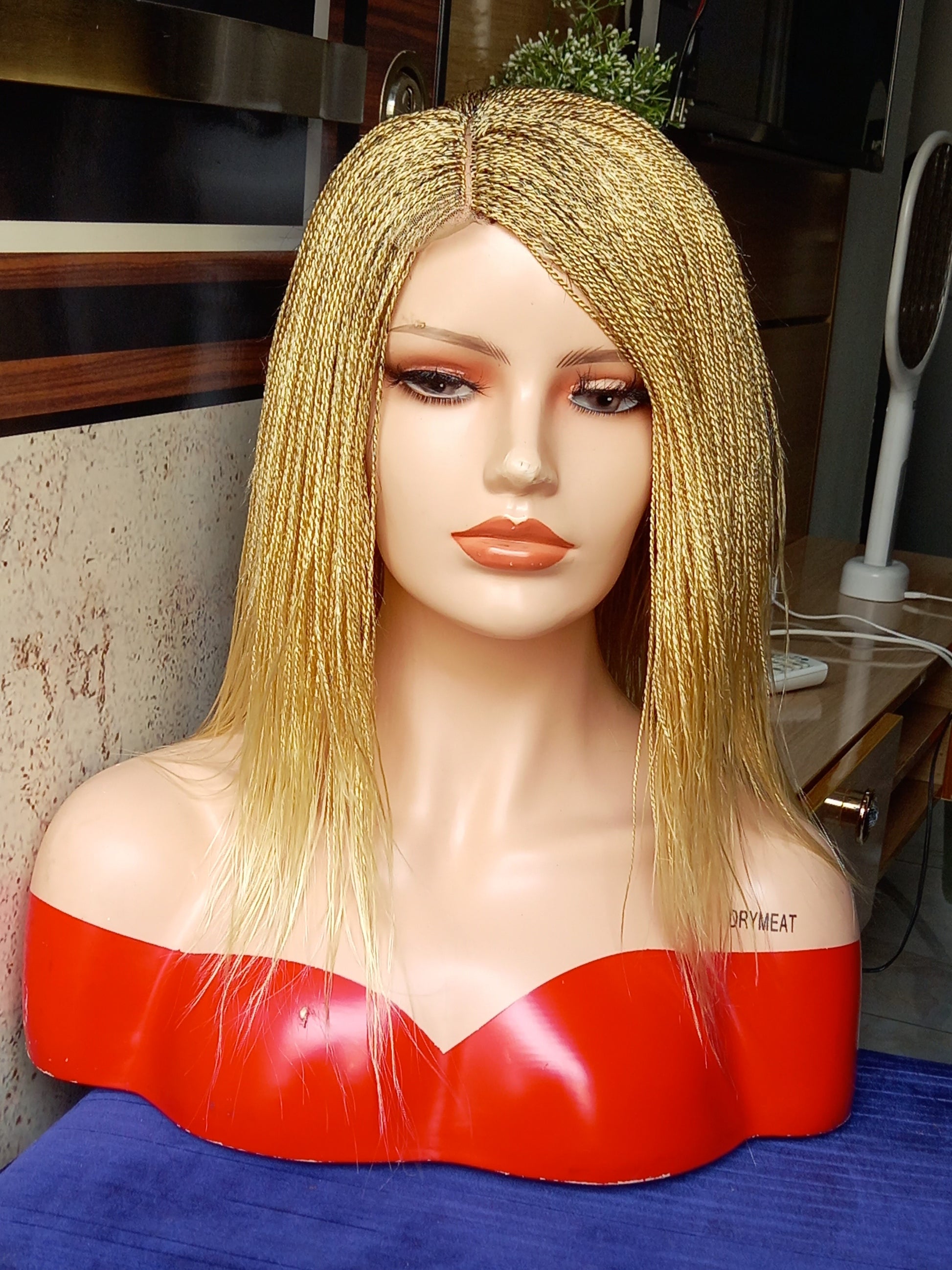 This beautiful blonde micro twist wig is a must-have for every woman. Available in different colors with free shipping on our website - BRAIDED WIG BOSS