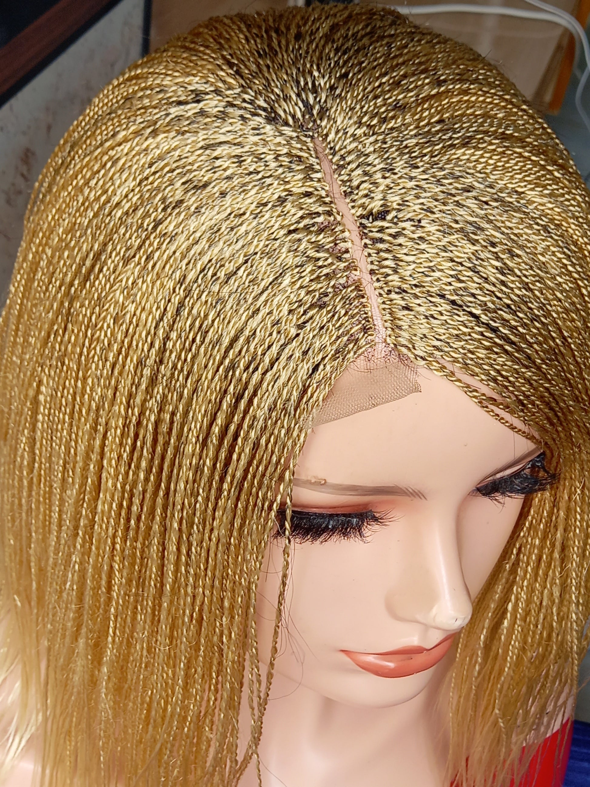 This beautiful blonde micro twist wig is a must-have for every woman. Available in different colors with free shipping on our website - BRAIDED WIG BOSS