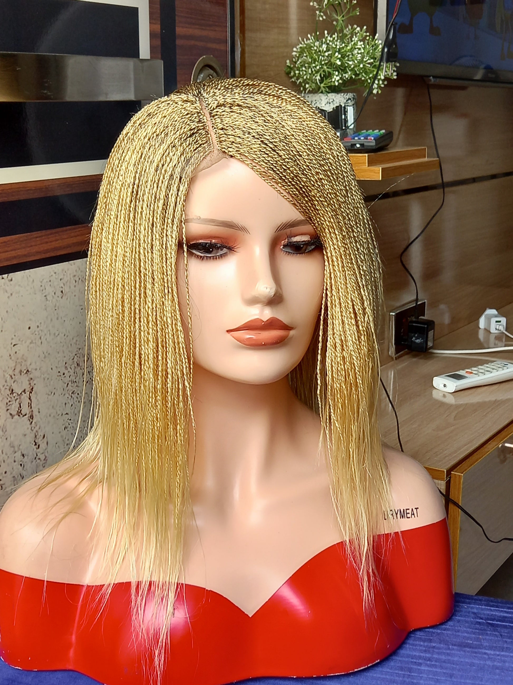 This beautiful blonde micro twist wig is a must-have for every woman. Available in different colors with free shipping on our website - BRAIDED WIG BOSS