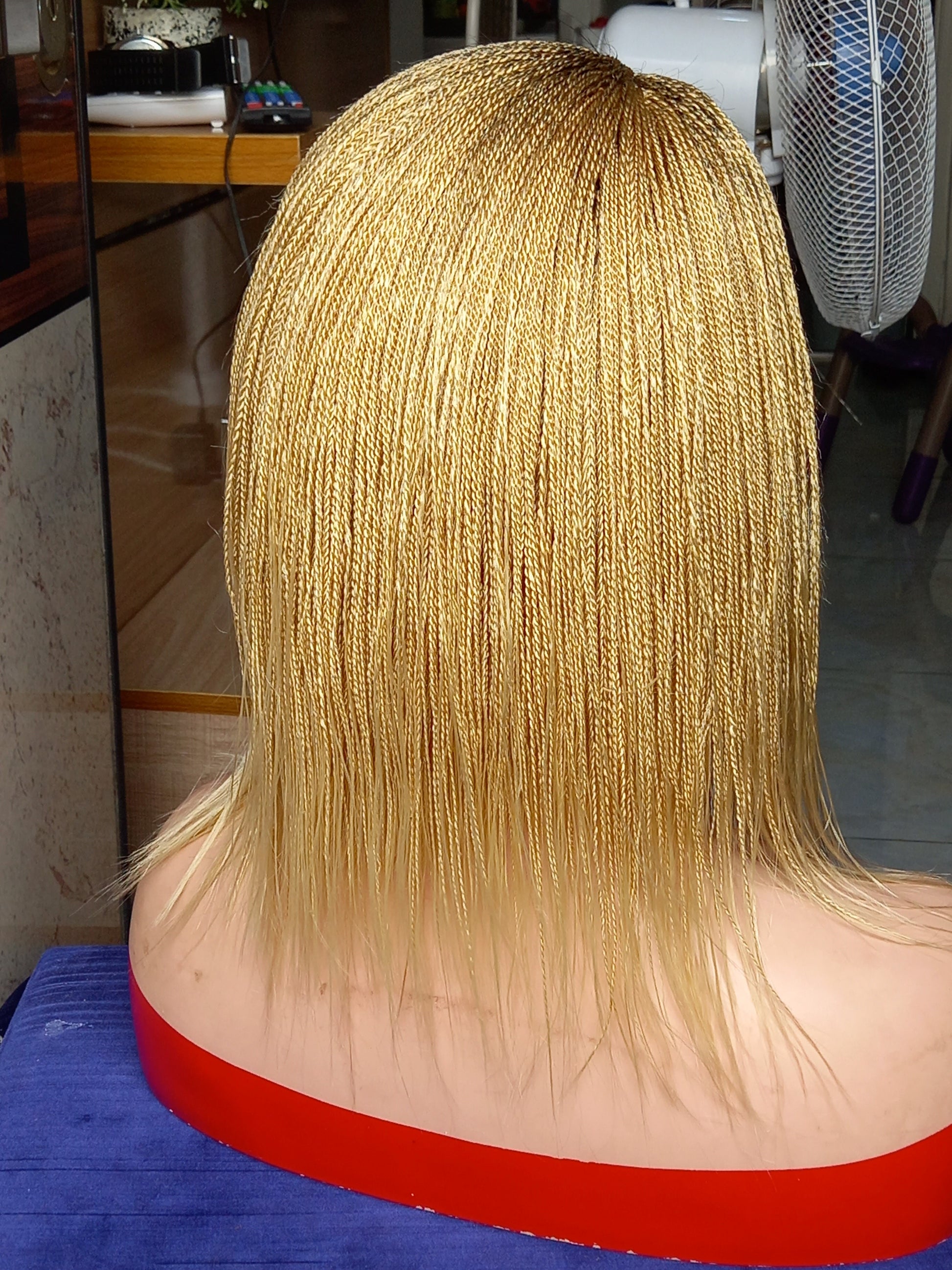 This beautiful blonde micro twist wig is a must-have for every woman. Available in different colors with free shipping on our website - BRAIDED WIG BOSS