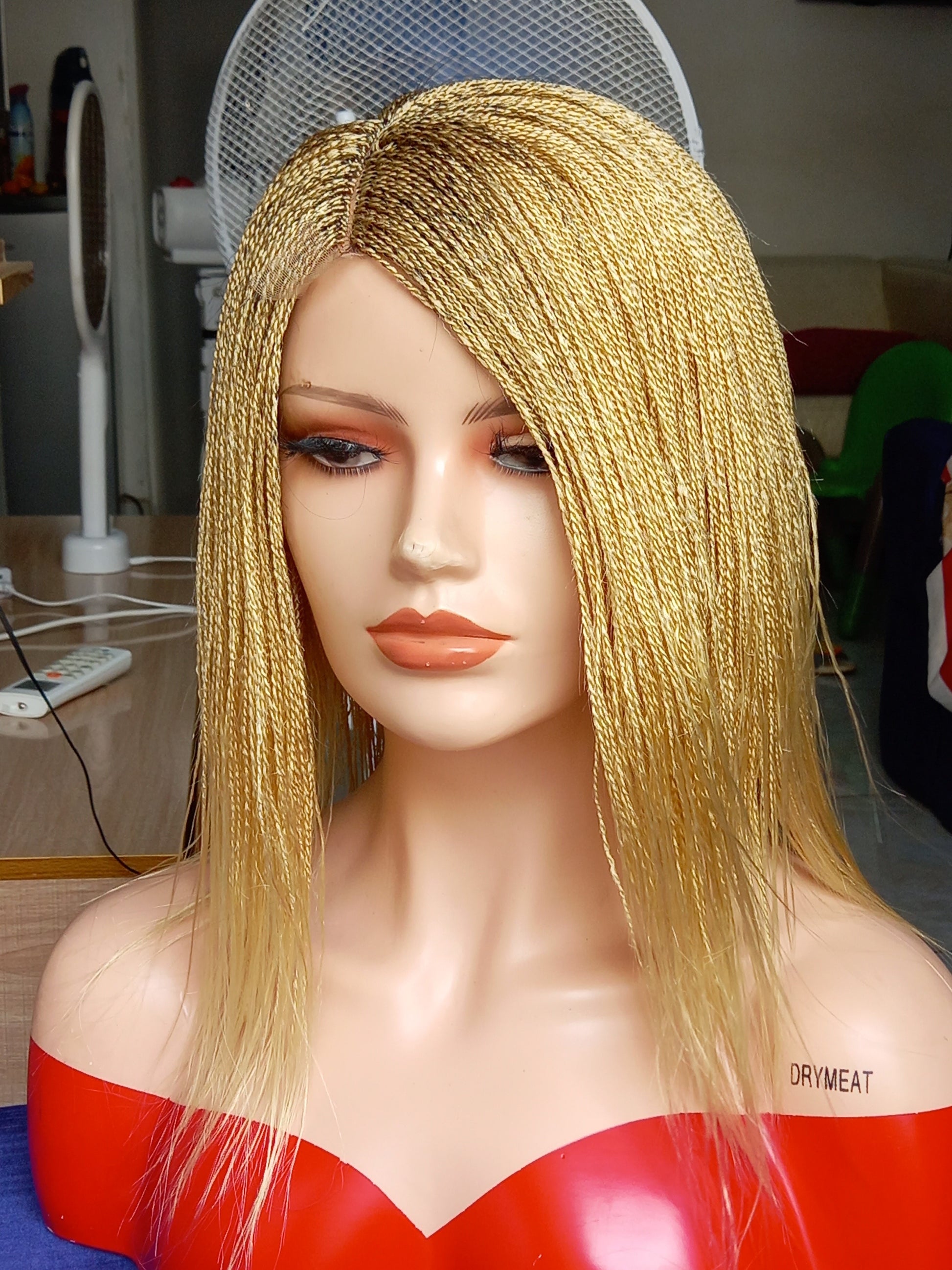 This beautiful blonde micro twist wig is a must-have for every woman. Available in different colors with free shipping on our website - BRAIDED WIG BOSS