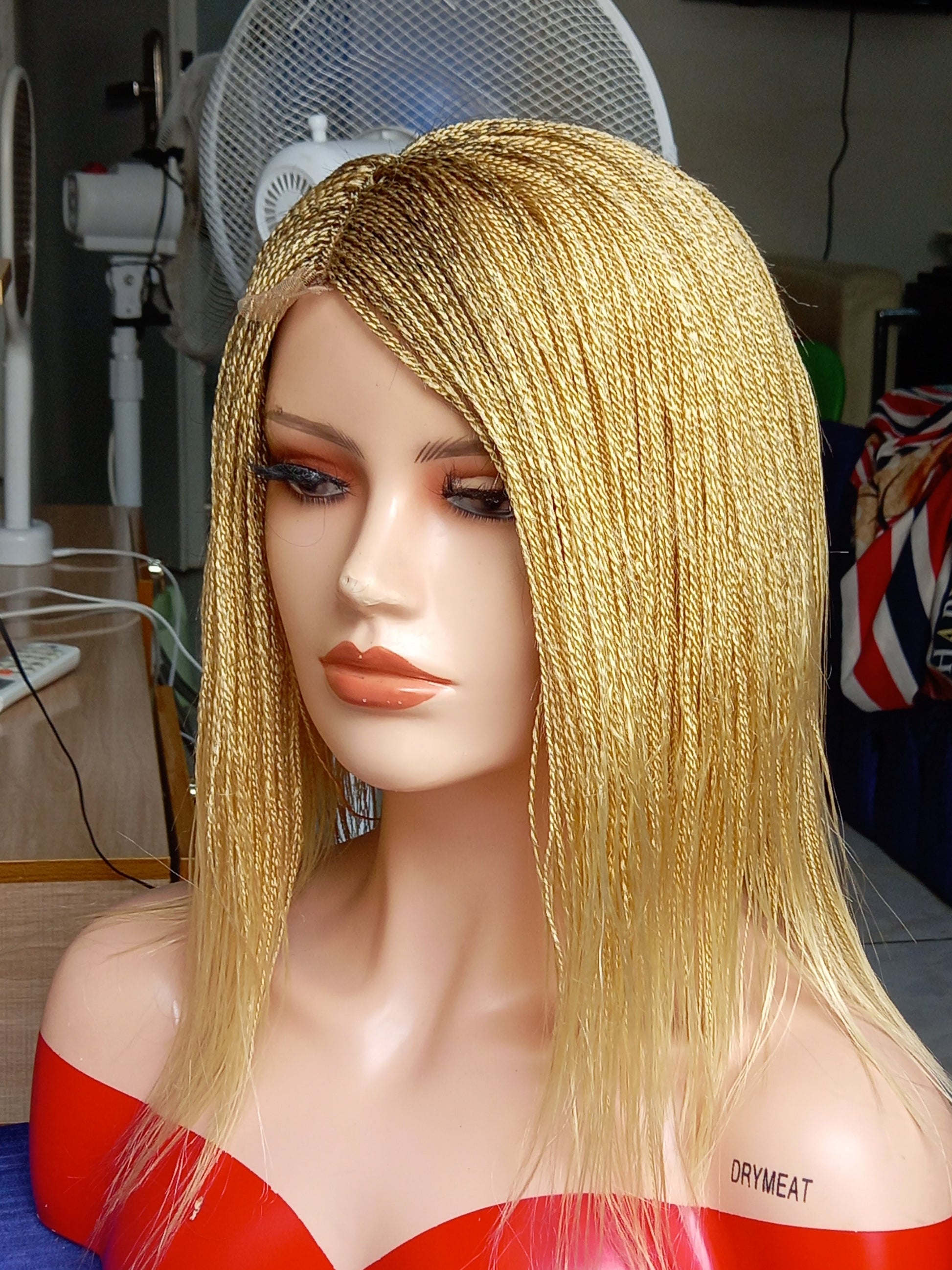 This beautiful blonde micro twist wig is a must-have for every woman. Available in different colors with free shipping on our website - BRAIDED WIG BOSS