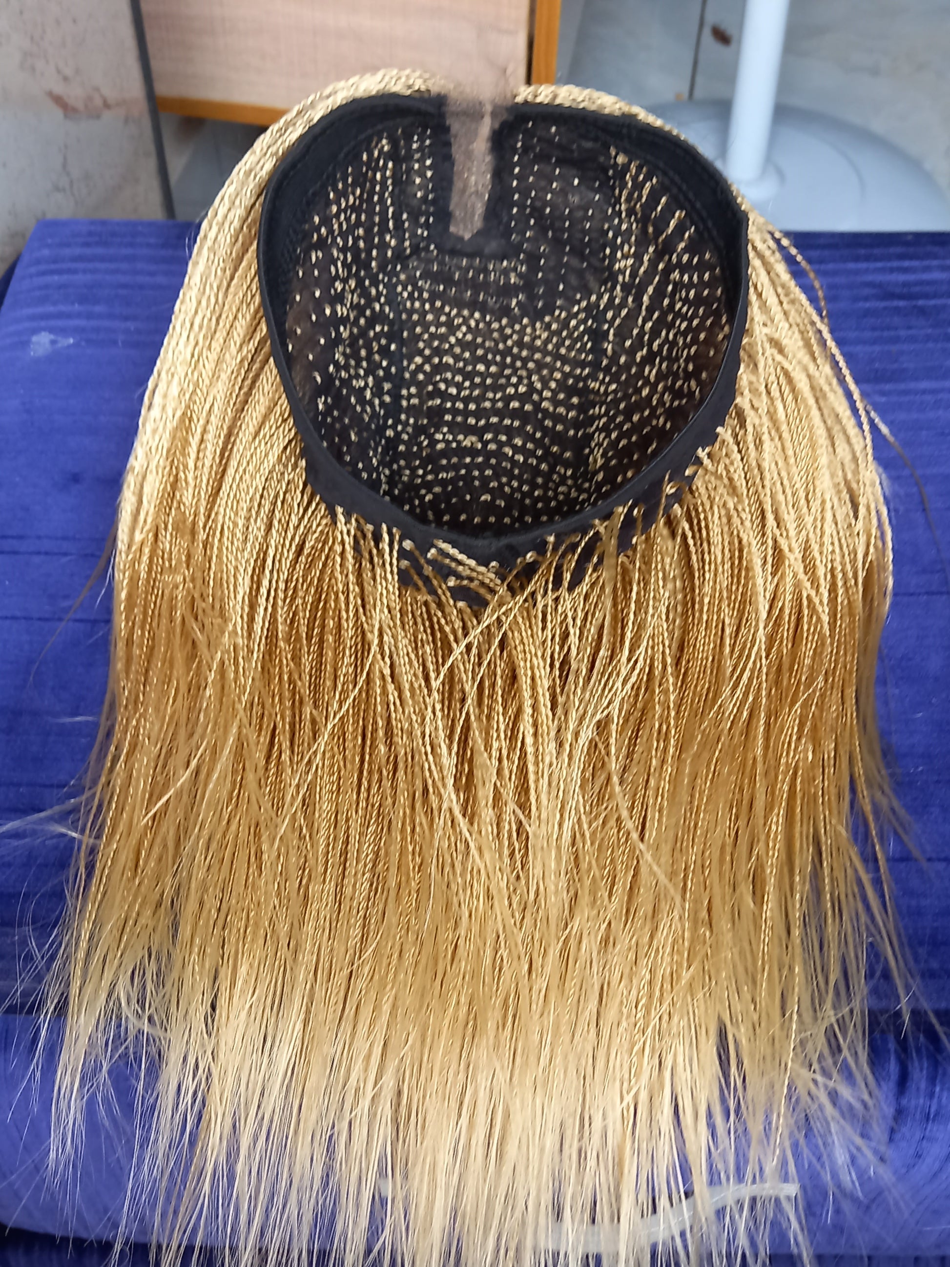 This beautiful blonde micro twist wig is a must-have for every woman. Available in different colors with free shipping on our website - BRAIDED WIG BOSS